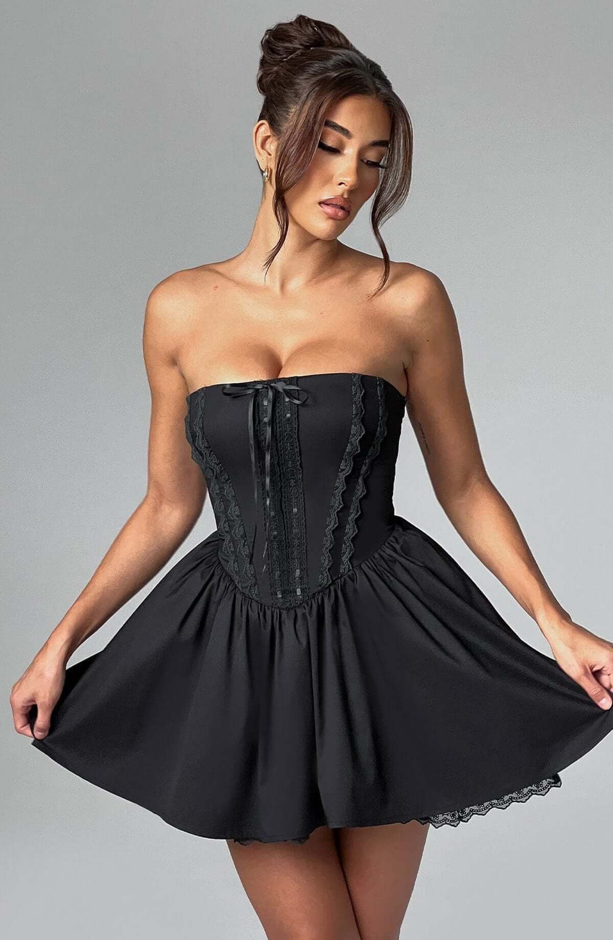 Stylish black corset mini dress with strapless neckline, perfect for cocktail parties and formal events.