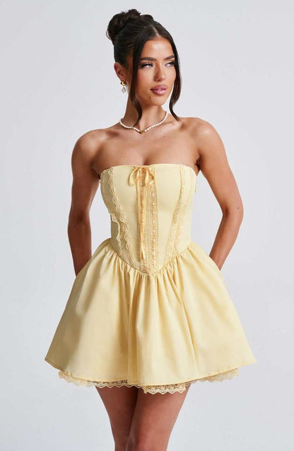 Skye Mini Dress featuring a strapless corset design in yellow, perfect for summer events and stylish occasions.