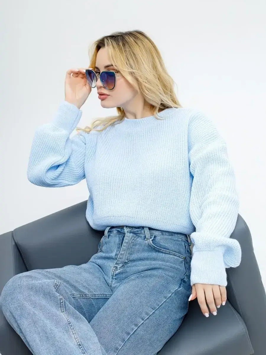 Skylar Pullover by Lauven, cropped knit in sky blue worn with jeans and sunglasses.