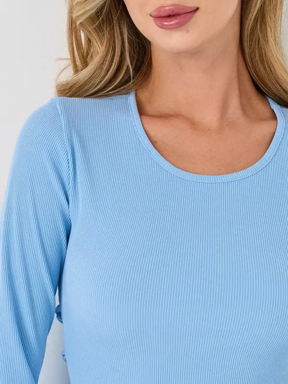 Close-up of a woman's neckline and shoulder in a soft ribbed light blue long sleeve dress, ideal for summer styling.