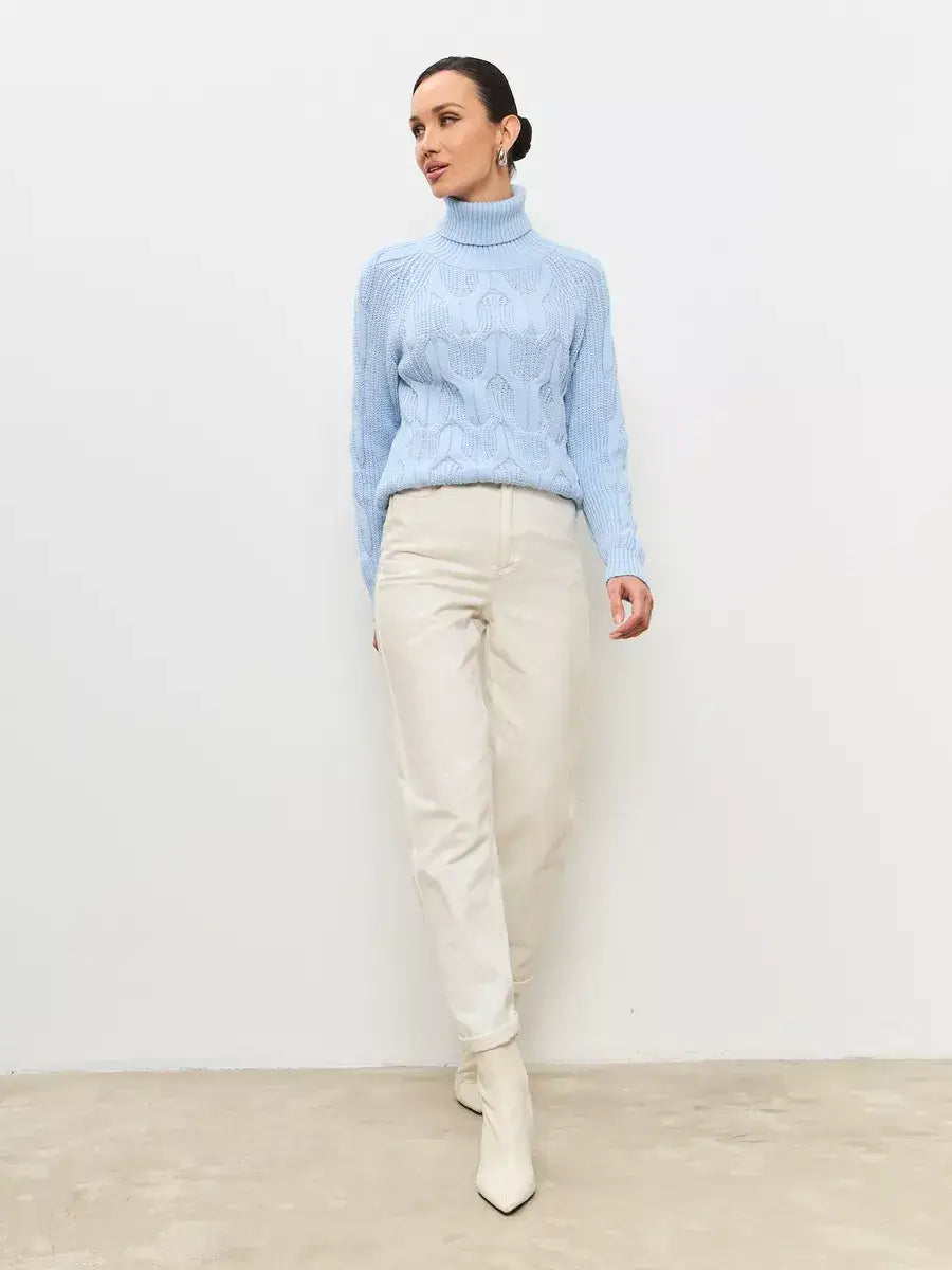 Skyline Knitwear by Lauven: Women's oversized wool-blend turtleneck sweater in soft pastel blue, featuring a classic cable-knit pattern.