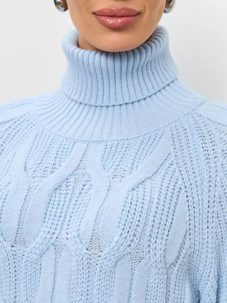 Close-up of Skyline Knitwear, a women's wool-blend turtleneck sweater by Lauven in soft pastel blue.