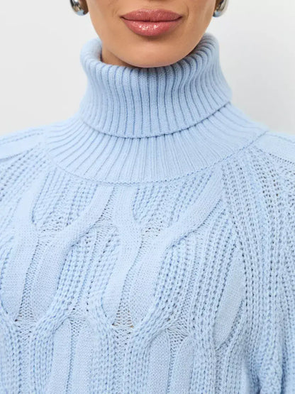 Close-up of Skyline Knitwear, a women's wool-blend turtleneck sweater by Lauven in soft pastel blue.