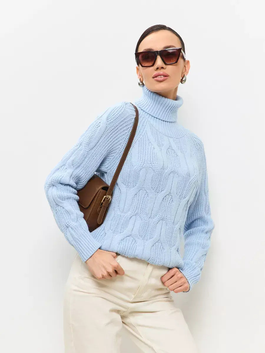 Elegant model wearing Skyline Knitwear, a pastel blue wool-blend turtleneck sweater by Lauven.