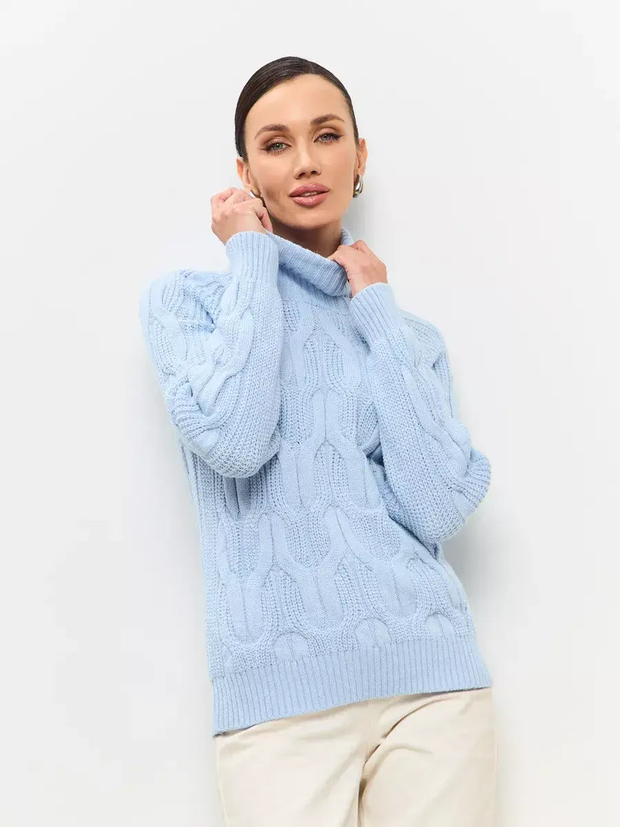 Stylish woman in a pastel blue Skyline Knitwear turtleneck sweater from Lauven, showcasing a cable-knit design.