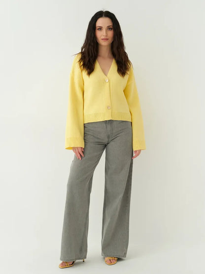 Solara Cardigan by Lauven - Vibrant cropped yellow knit cardigan with heart buttons and stylish design.