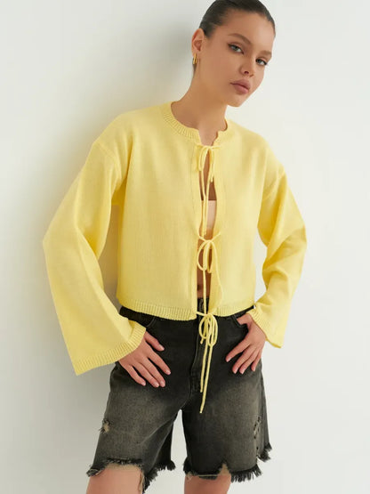 Solara Cardigan by Lauven - Cropped yellow knit with tie-front detailing, perfect for summer layering.