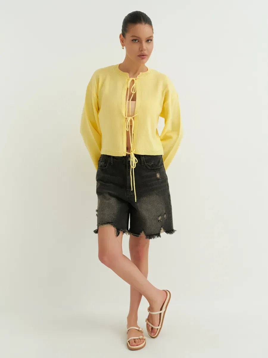 Solara Cardigan by Lauven, cropped yellow knit with tie-front, perfect for summer layering and versatile styling.