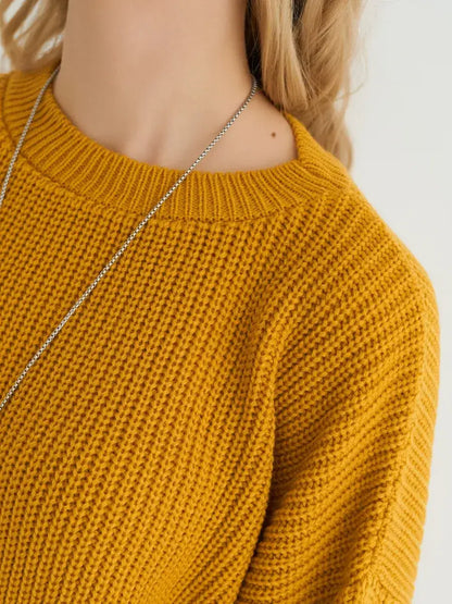 Solara Sweater by Lauven in mustard yellow knit showcasing its contemporary oversized fit.