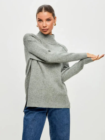 Sterling Sweater by Lauven, oversized cashmere blend in soft grey worn by model showcasing stylish elegance.