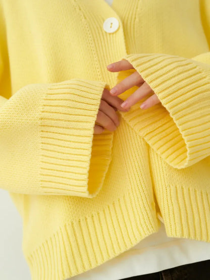 Sunny Cardigan by Lauven – Cozy oversized yellow knitwear with button closure and ribbed sleeves.