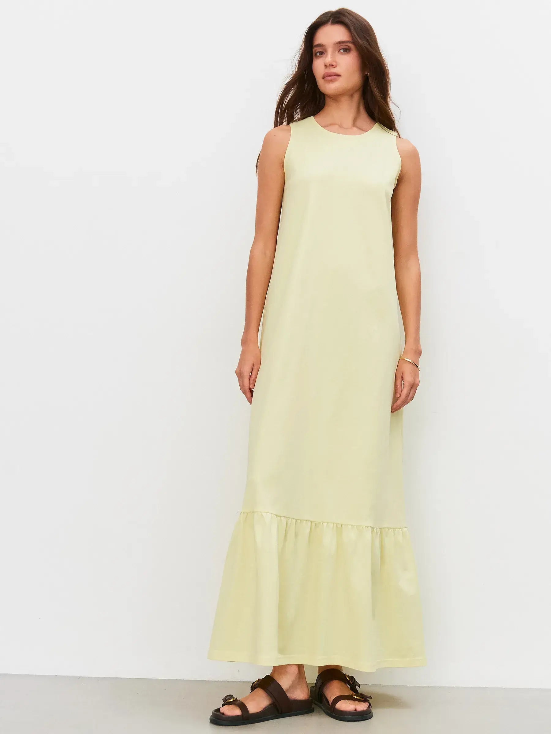 Sunrise Maxi Dress in light lemon hue, featuring a relaxed fit and gathered hem flounce for effortless summer style.
