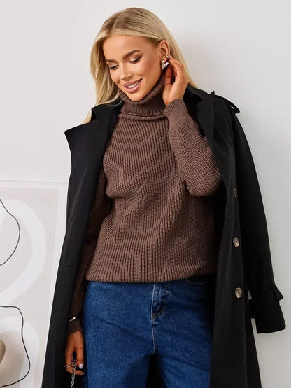 Model wearing the Terra Sweater by Lauven, an oversized brown knit with a stylish turtleneck.