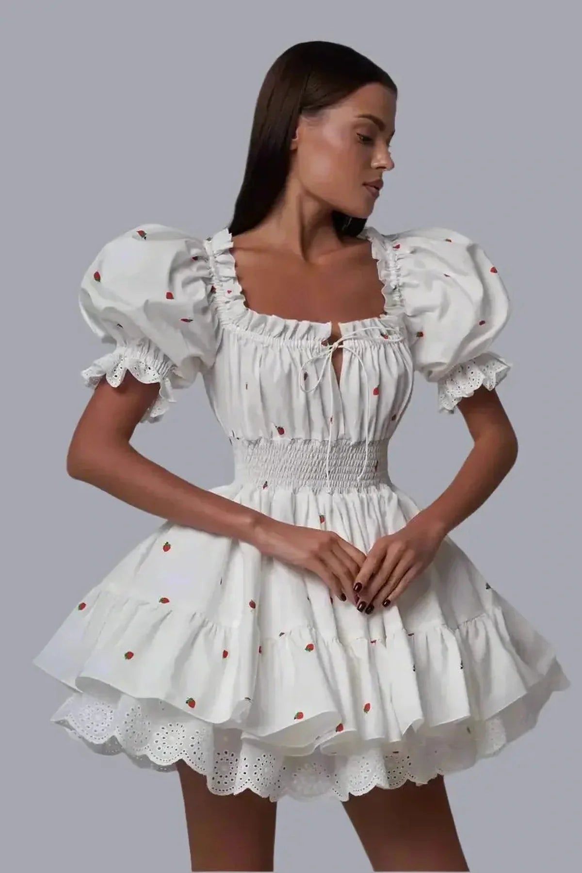 Thea Mini Dress featuring puff sleeves, a milkmaid neckline, and a playful flared silhouette, perfect for summer outings.