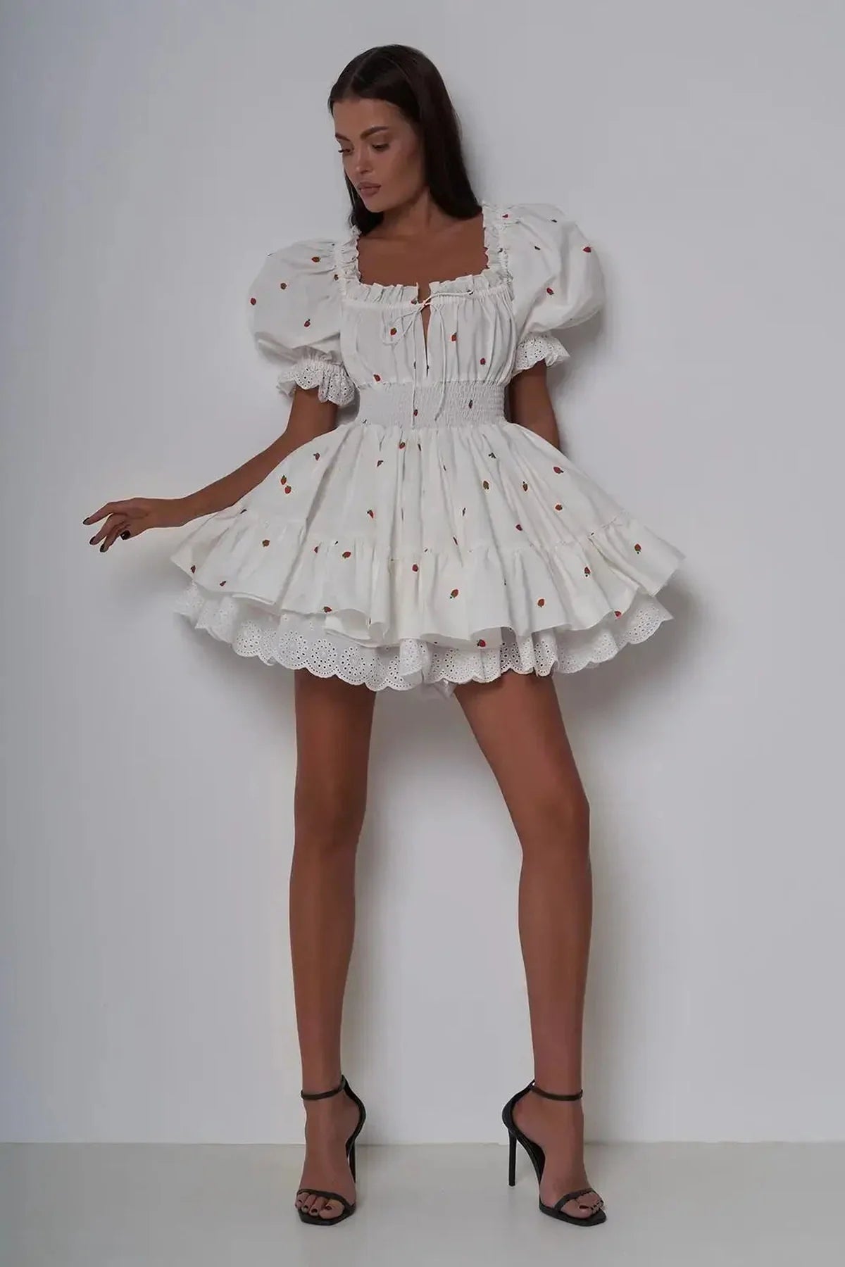 Thea Mini Dress in white with puff sleeves, perfect for summer weddings, parties, or casual outings.