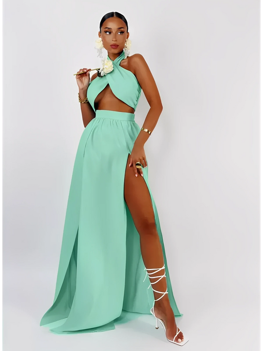 Model wearing Tiffany Breeze Set, featuring a mint halter crop top and high-slit maxi skirt, exuding summer elegance.