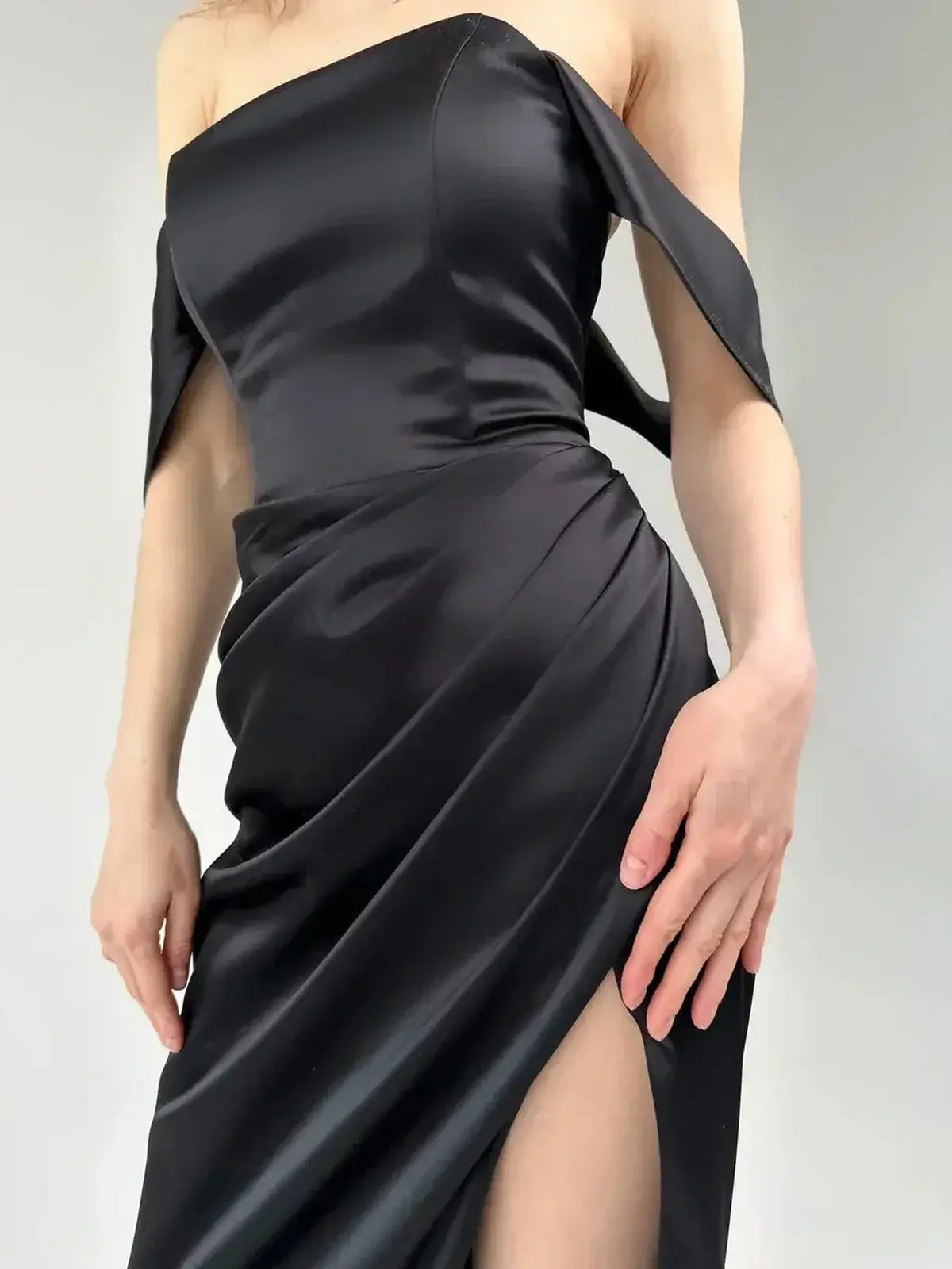 Elegant off-shoulder Velour Nights Maxi Dress featuring draping and a high slit for chic evening allure.