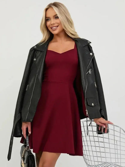 Model wearing a deep burgundy mini dress with a leather jacket, perfect for summer parties and special occasions.