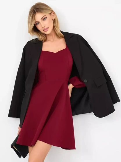 Chic deep burgundy velvet mini dress with tailored bodice and voluminous long sleeves, perfect for parties and formal occasions.