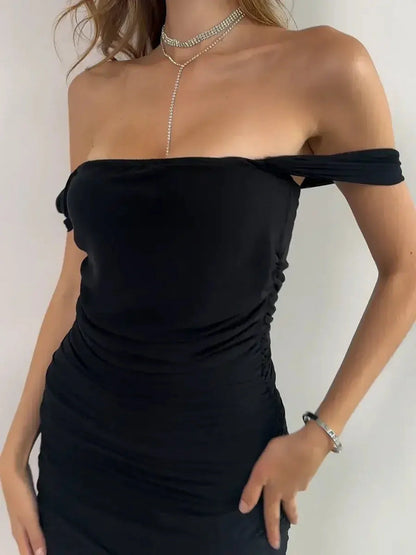 Sleek off-shoulder black dress with artful ruching, perfect for summer parties and special occasions.
