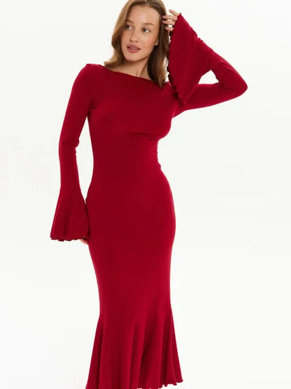 Elegant red long sleeve velvet flare dress with flared cuffs and fishtail hem, perfect for formal occasions.