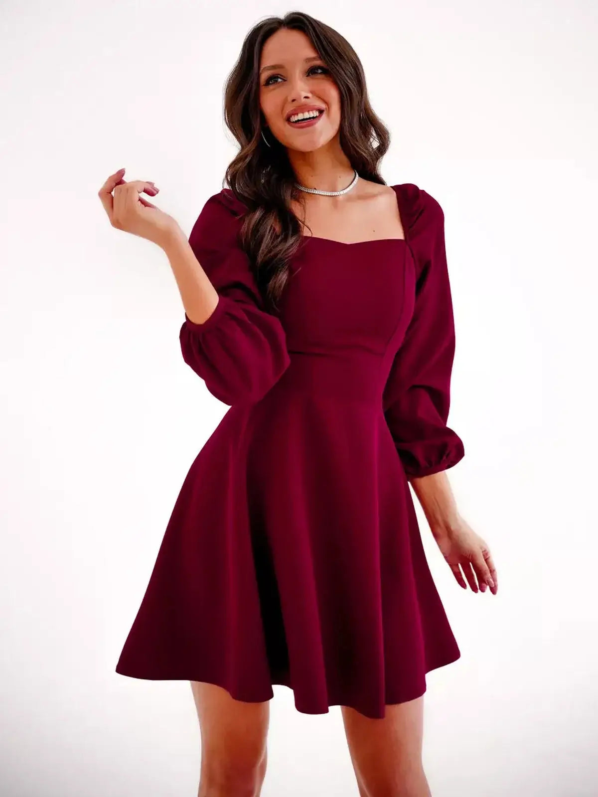 Velvet Ruby deep burgundy mini dress with structured square neckline and voluminous long sleeves, perfect for summer and cocktail occasions.