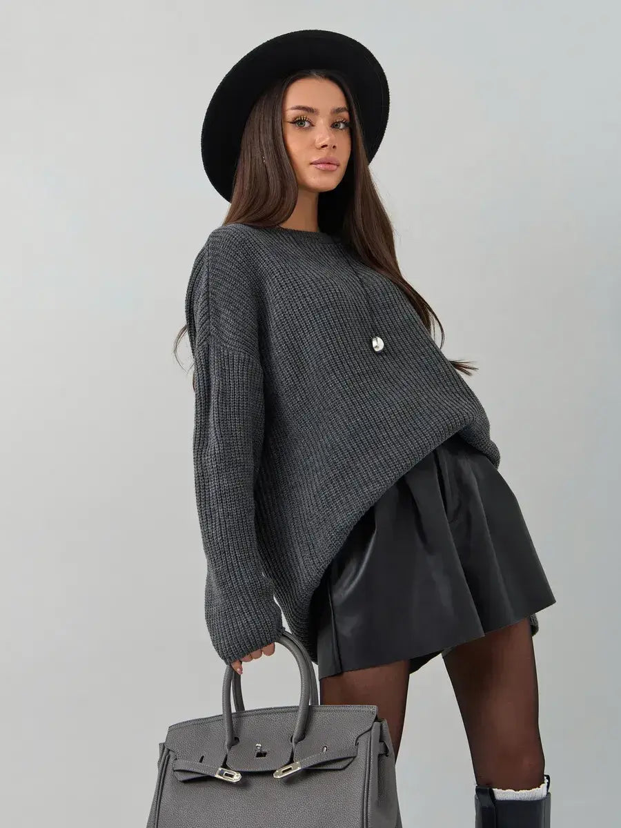 Vera Sweater by Lauven, oversized dark gray knit pullover with crew neck, styled with a chic hat and skirt.