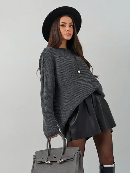 Vera Sweater by Lauven, oversized dark gray knit pullover with crew neck, styled with a chic hat and skirt.