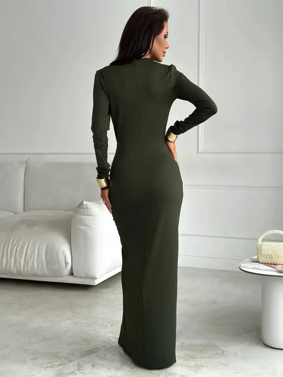 Verde Muse Maxi Dress in deep green, showcasing a sculpted fit and elegant design from the back, perfect for elevated occasions.