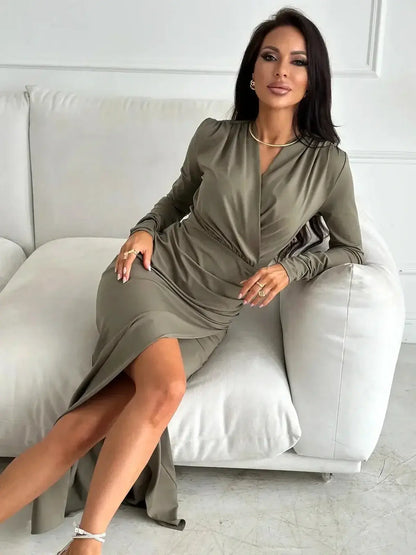 Model wearing the Verona Drape Maxi Dress in olive green, showcasing elegance with a thigh-slit and wrap-style bodice.