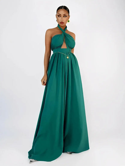 Verona Jumpsuit by Lauven in emerald green, featuring a halter neck, open back, and flowing wide leg design.