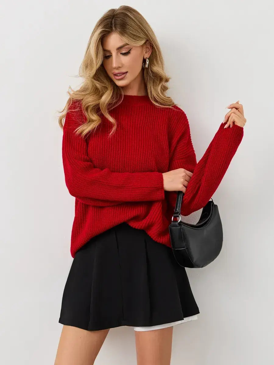 Viona Sweater by Lauven - Oversized red knit pullover with crew neck, styled with a black skirt.