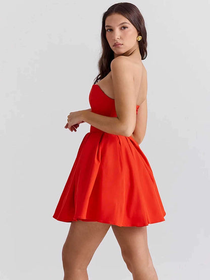Stylish red mini dress for women with a flattering strapless design and playful flared skirt, perfect for summer parties.