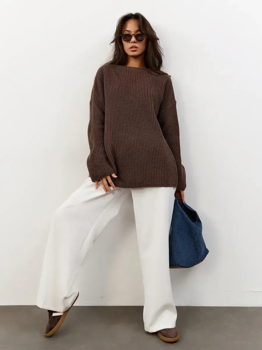 Zara Sweater by Lauven in oversized chocolate brown knit, styled with white pants and accessories.